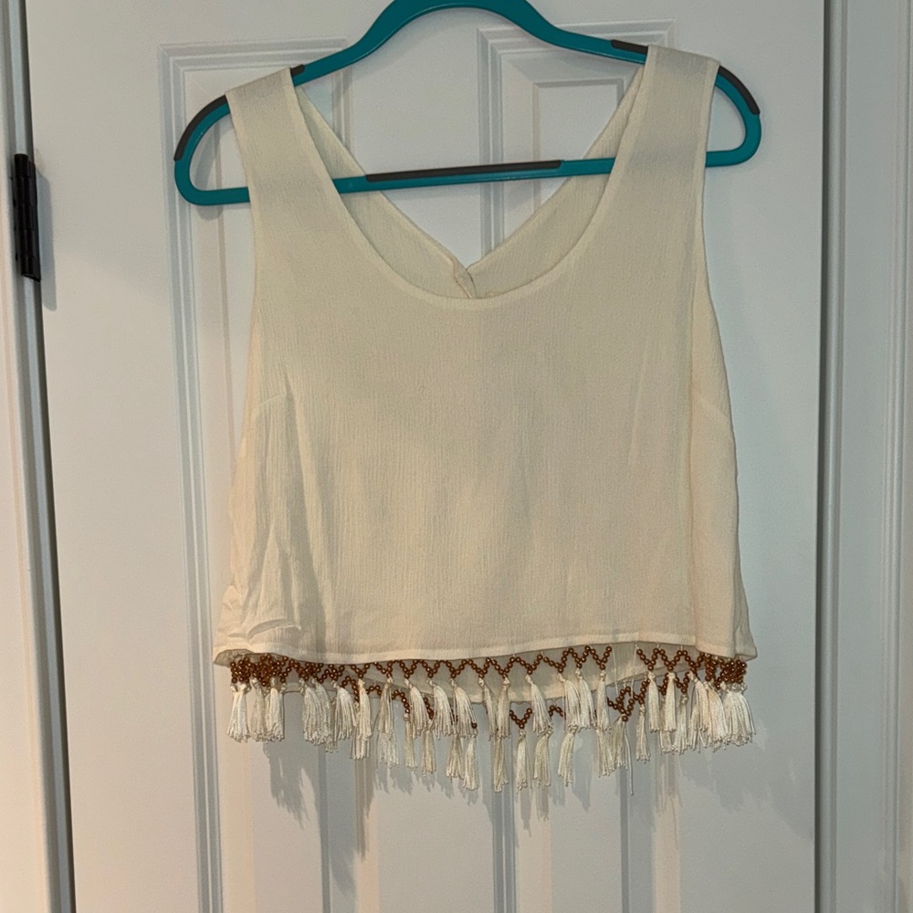 Sleeveless Cream Tassel Hem Crop Top